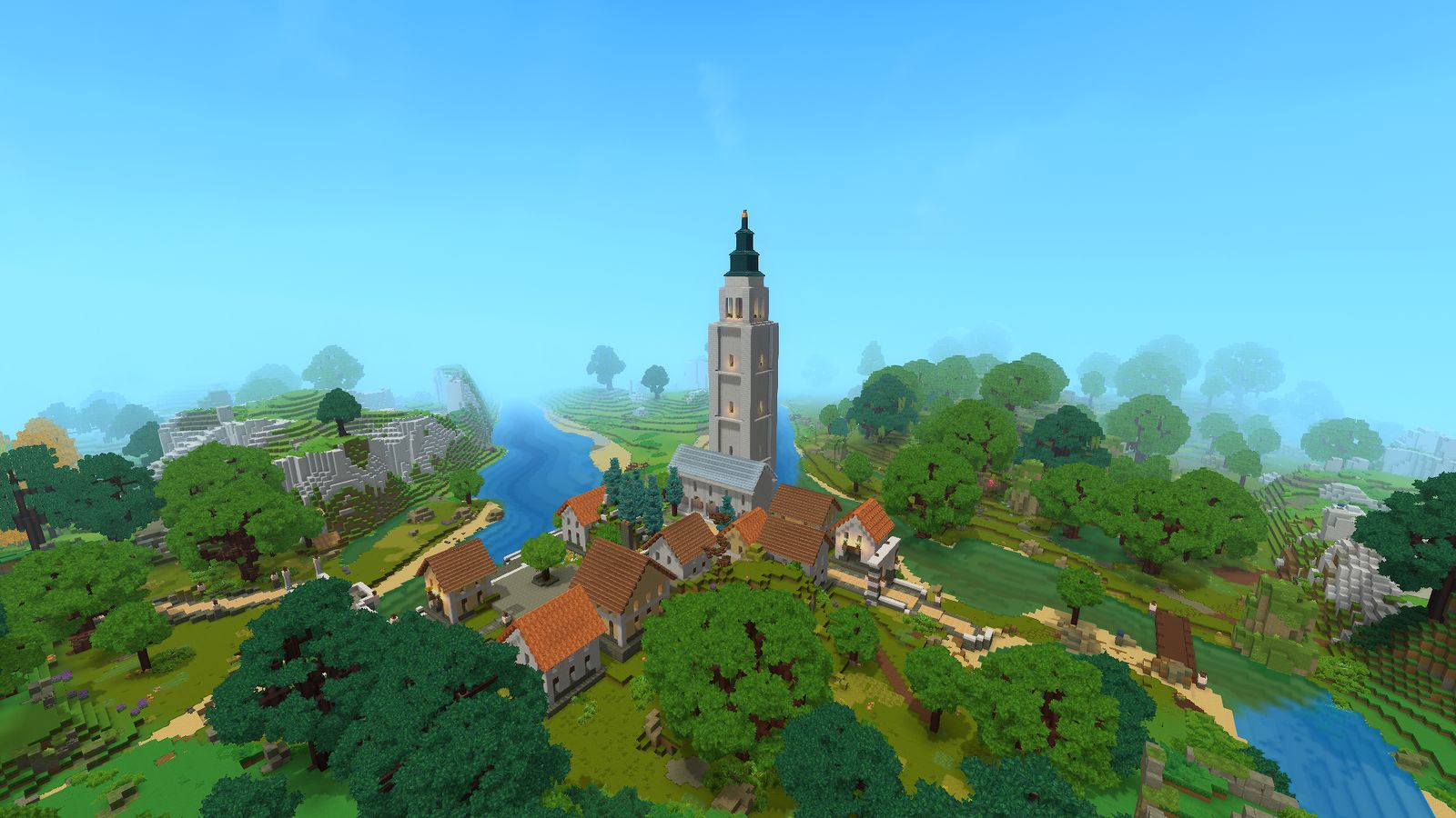 The Capital from the air: a tall stone tower above red-roofed houses, a river and green hills